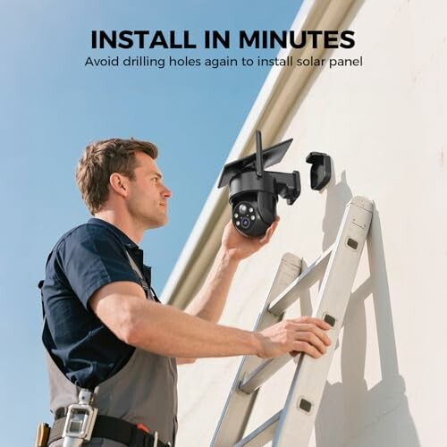 Person installing a solar panel camera on a wall using a ladder.