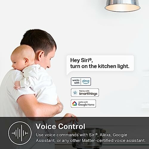 Man holding baby using voice control for smart home devices.