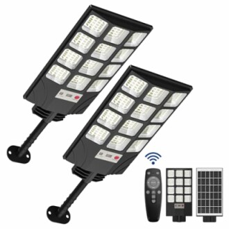 Two solar-powered security lights with remote and solar panels.